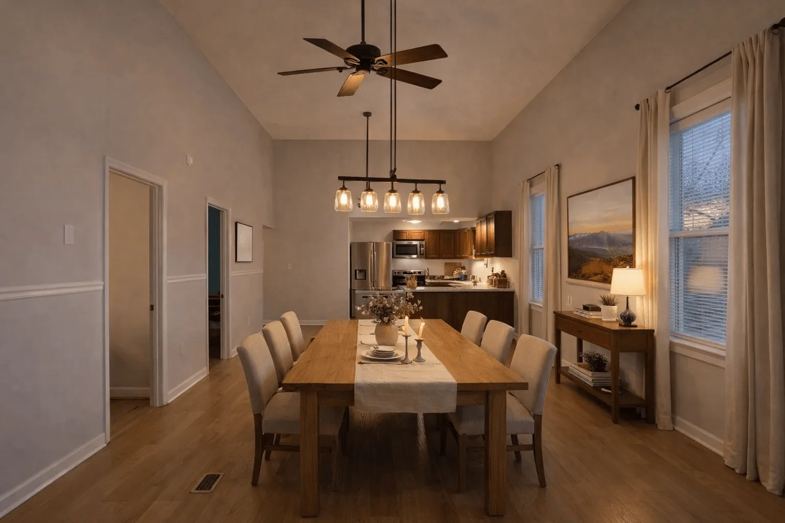 The dining room at 6043 Broad with a long table set for a shared meal under warm light