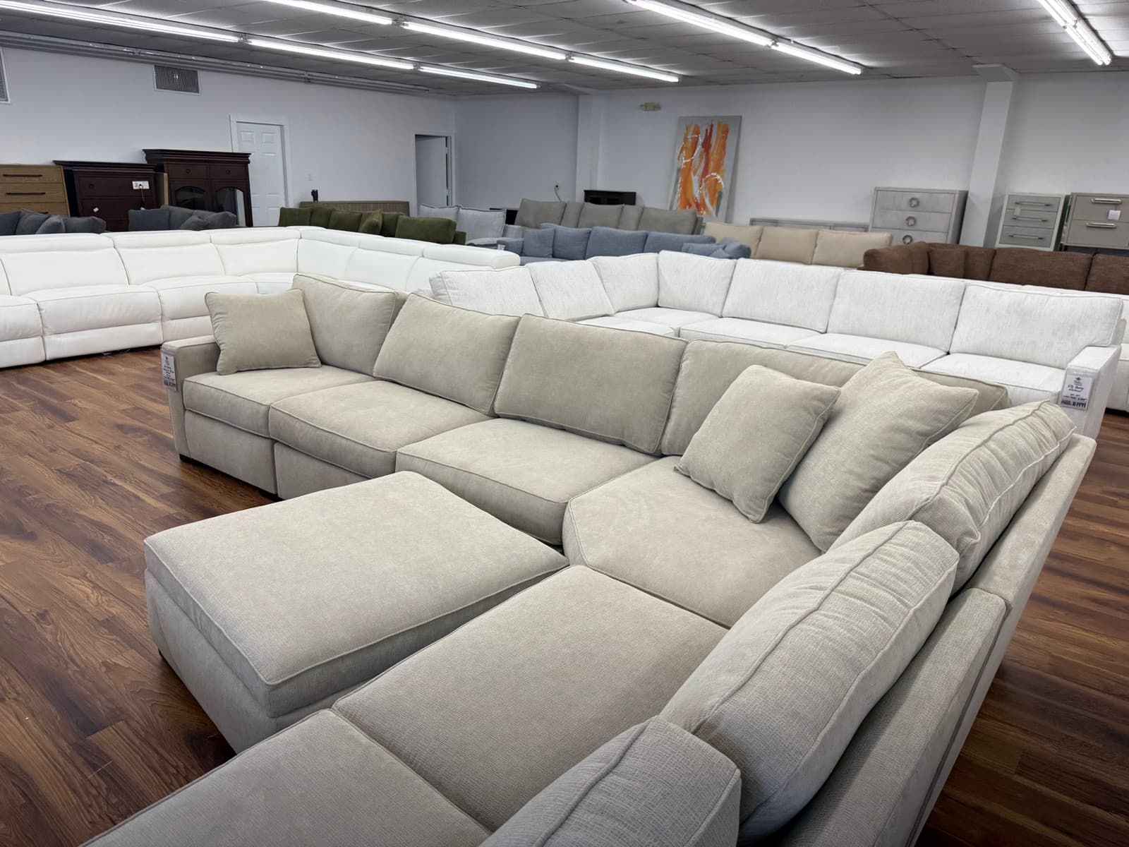 Showroom floor filled with sectional sofas ready for same-day pickup