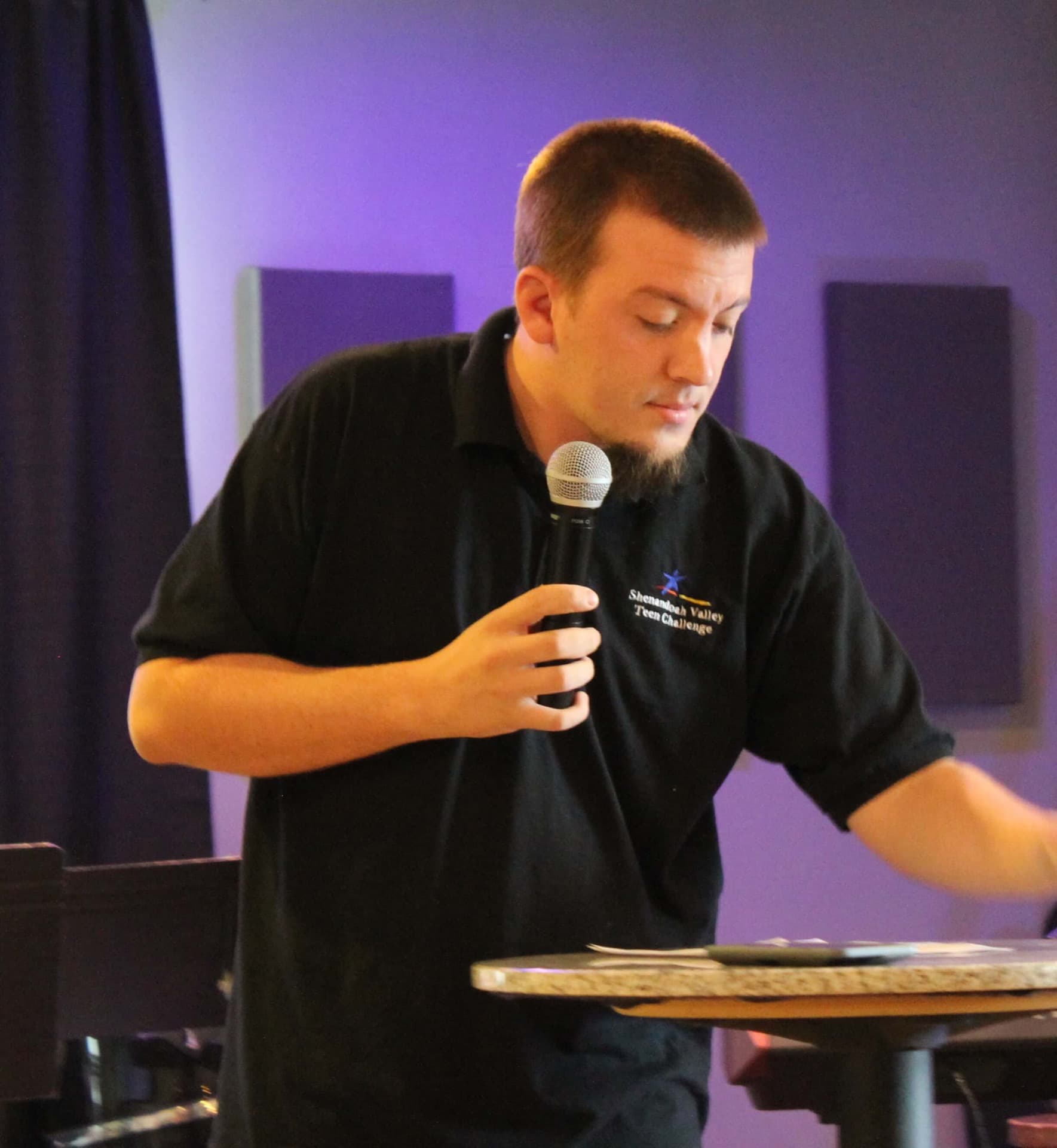 Justin Franich speaking to men during chapel