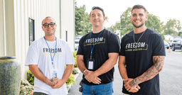 Three men in Teen Challenge Freedom From Addiction shirts standing outside the Shenandoah Valley facility